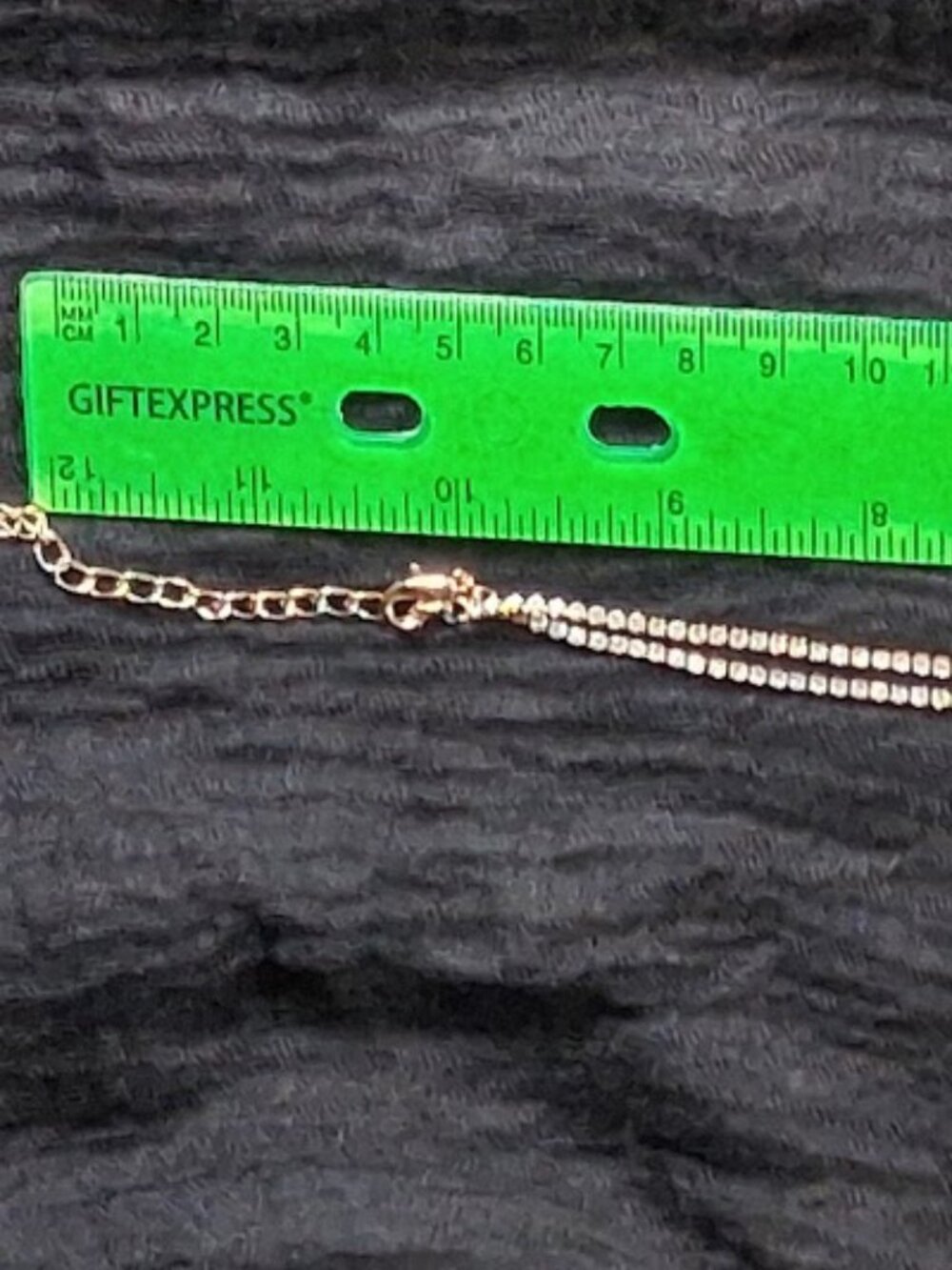 Gold-Tone Rhinestone Tassel Infinity Knot Necklace - Picture 8 of 11
